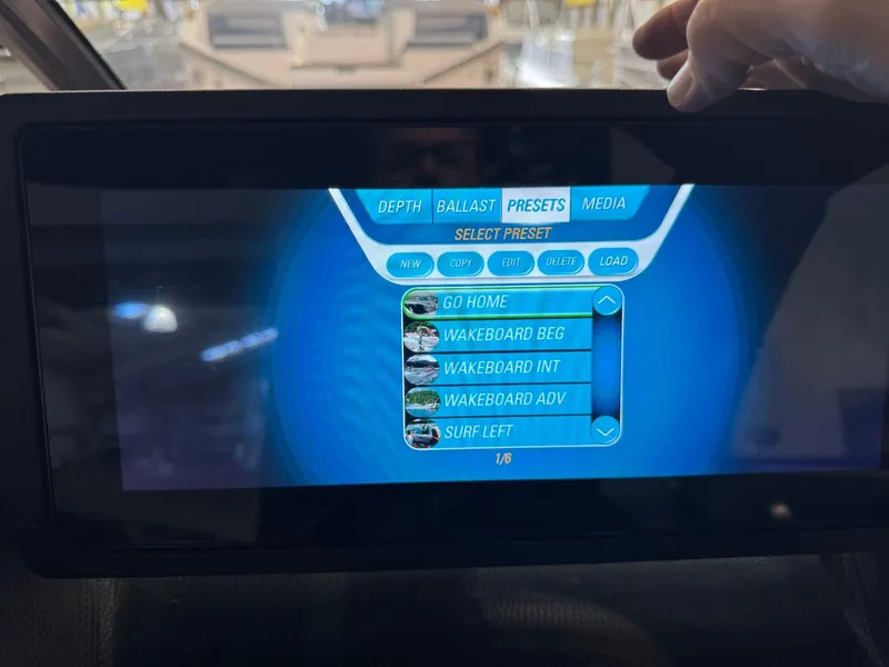 Slide: The Image of Touchscreen display of 2015 Malibu Wakesetter 22 MXZ showing wakeboard and surf presets. - 39