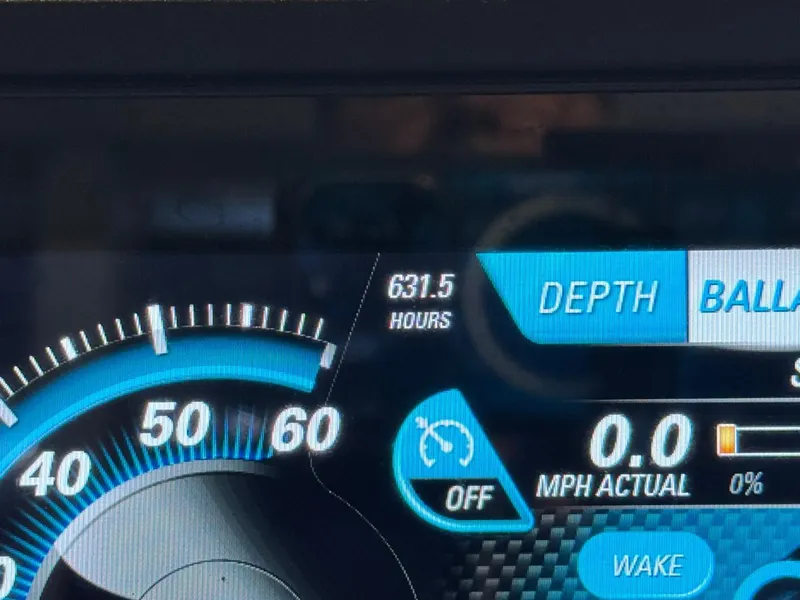 Slide: The Image of Dashboard of 2015 Malibu Wakesetter 22 MXZ showing 631.5 hours and speedometer. - 41