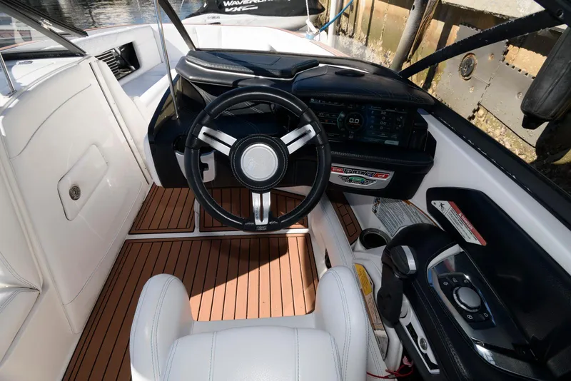 Slide: The Image of 2017 Nautique Super Air Nautique G25 boat interior with speakers and seating. - 6