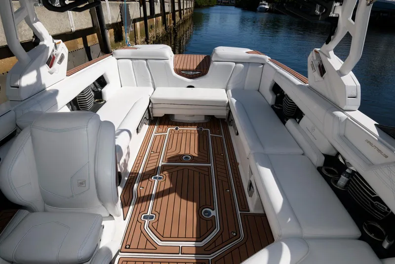 Slide: The Image of 2017 Nautique Super Air Nautique G25 interior with white seating and sleek dashboard design. - 9