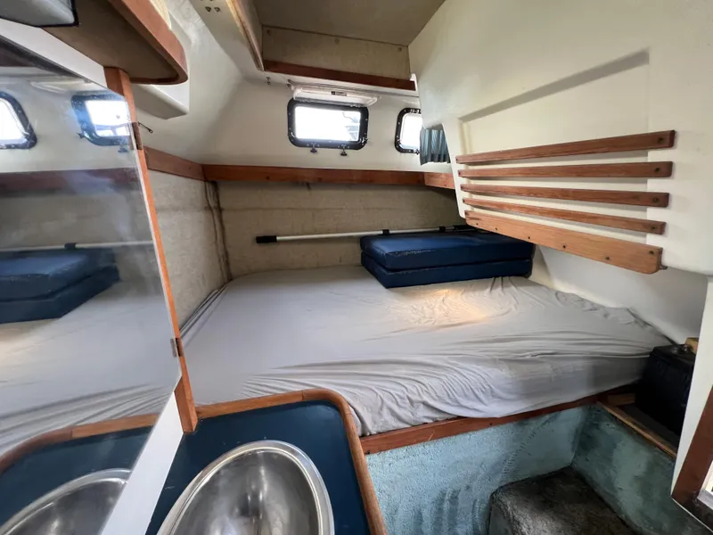 Slide: The Image of Interior cabin of 1987 Carver Riviera 2807 with bed and sink. - 19