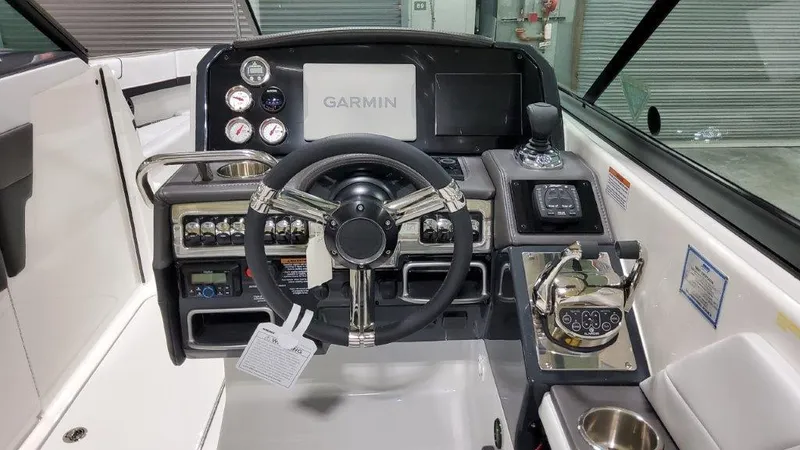 Slide: The Image of 2025 Formula 290 Bowrider cockpit with Garmin navigation system and modern controls. - 10