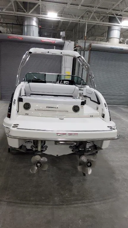 Slide: The Image of 2025 Formula 290 Bowrider boat in a warehouse, rear view. - 15