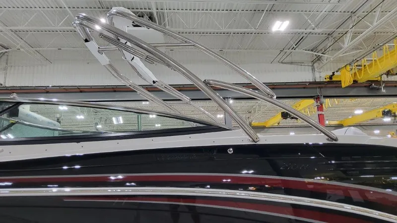 Slide: The Image of 2025 Formula 290 Bowrider boat with sleek design in a showroom. - 3
