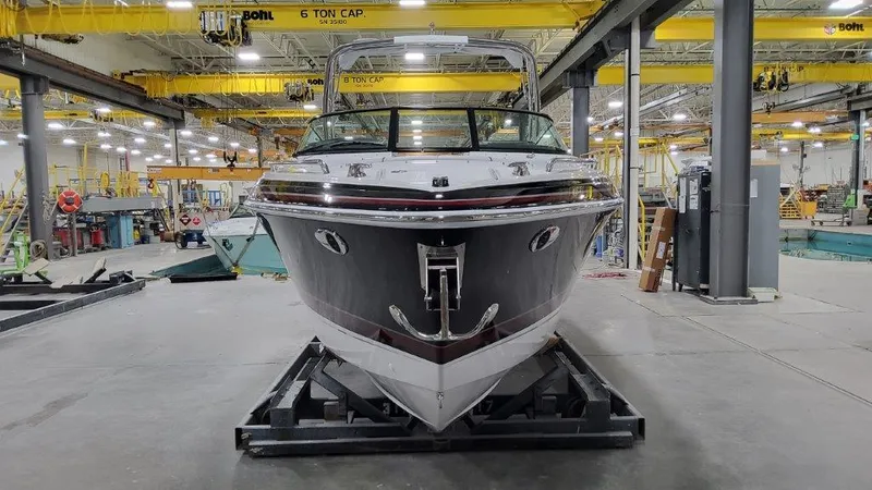 Slide: The Image of 2025 Formula 290 Bowrider boat in a manufacturing facility. - 4