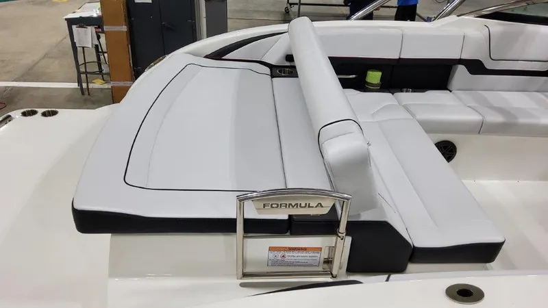 Slide: The Image of 2025 Formula 290 Bowrider boat interior with sleek white seating and modern design. - 5