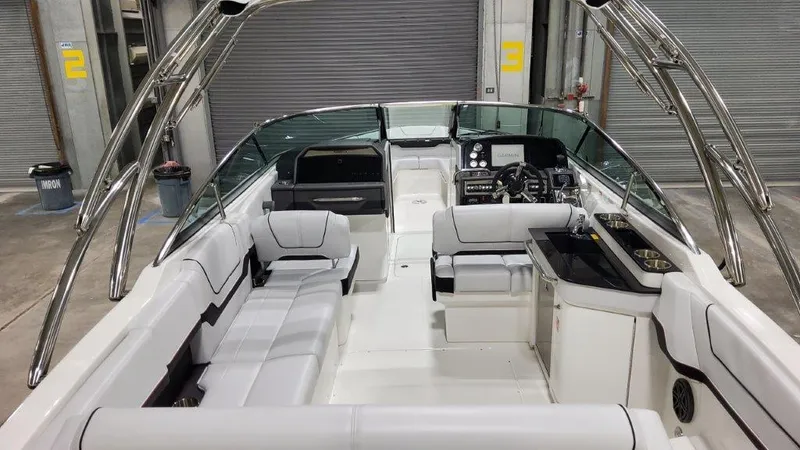 Slide: The Image of 2025 Formula 290 Bowrider boat interior with sleek seating and modern dashboard. - 6
