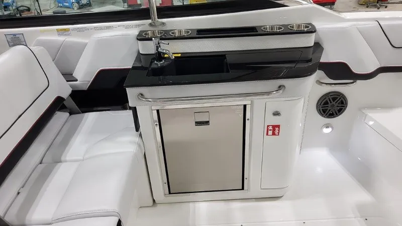Slide: The Image of 2025 Formula 290 Bowrider interior with sleek seating and modern kitchenette. - 7