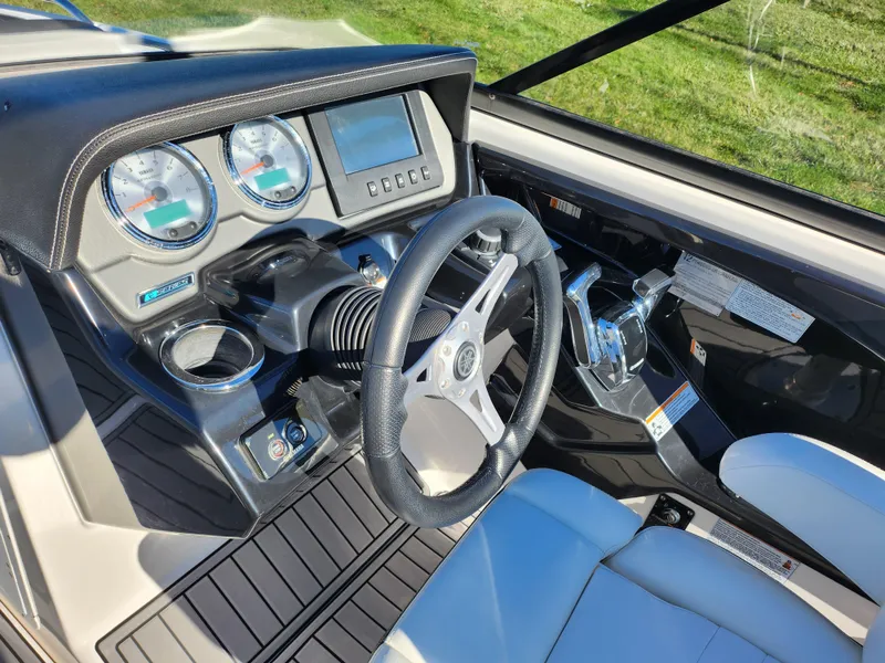Slide: The Image of 2016 Yamaha Boats 242 Limited S dashboard with steering wheel and controls. - 14