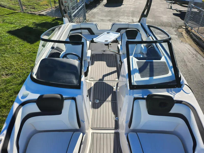Slide: The Image of 2016 Yamaha Boats 242 Limited S interior with open seating and sleek design. - 18