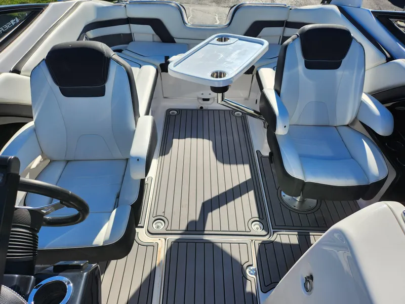 Slide: The Image of 2016 Yamaha Boats 242 Limited S interior with seating and table. - 19