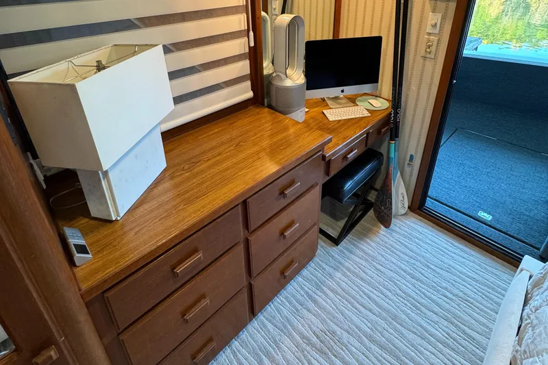 Slide: The Image of Interior of 1997 Lazy Days River Cruiser with desk, computer, and lamp. - 11