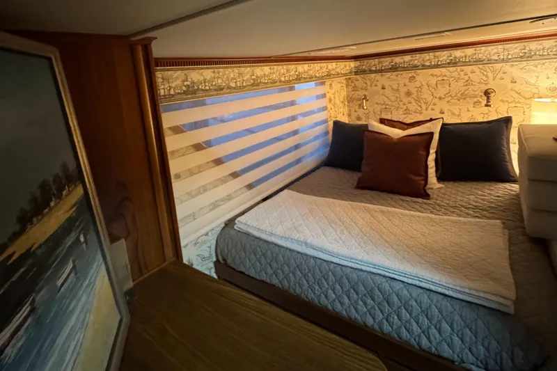 Slide: The Image of Cozy bedroom in 1997 Lazy Days River Cruiser with striped blinds and decorative pillows. - 15