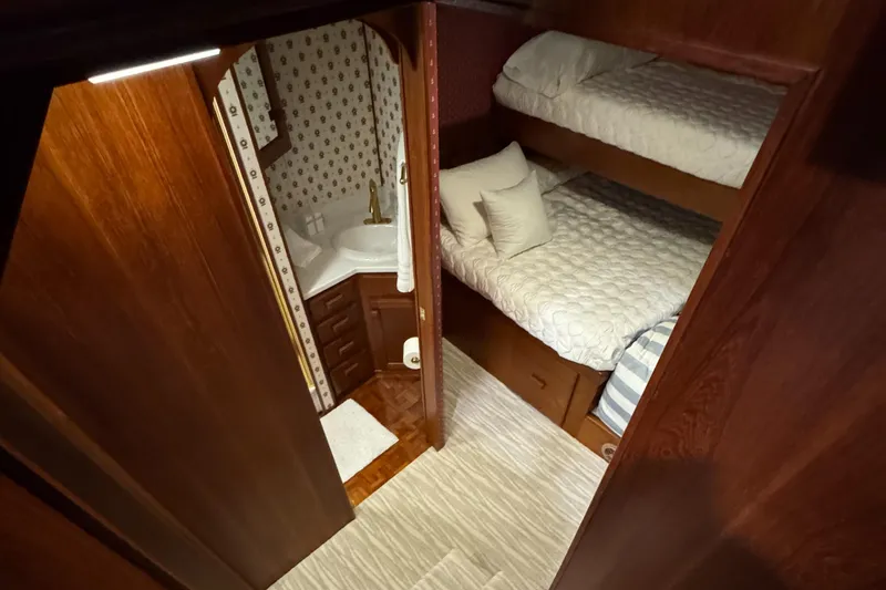Slide: The Image of Cozy 1997 Lazy Days River Cruiser cabin with bunk beds and compact bathroom. - 17