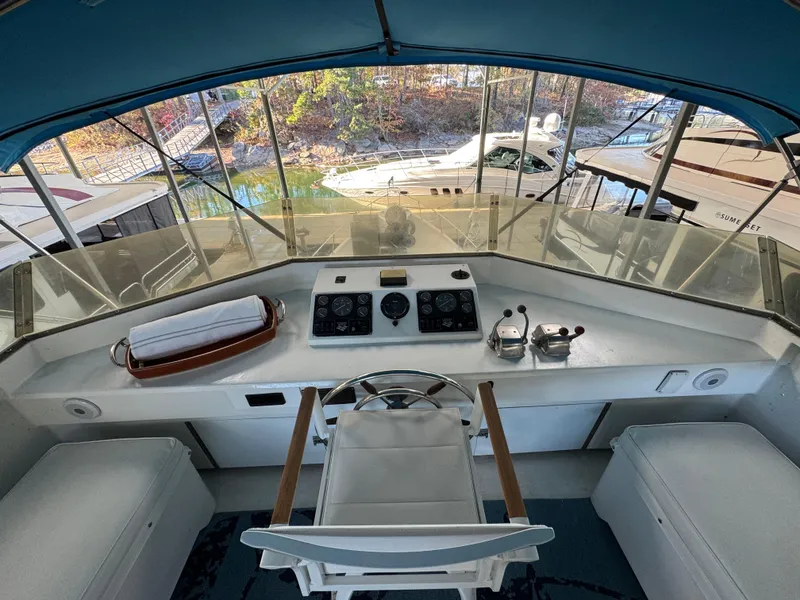 Slide: The Image of Interior view of 1997 Lazy Days River Cruiser helm with controls and seating. - 18