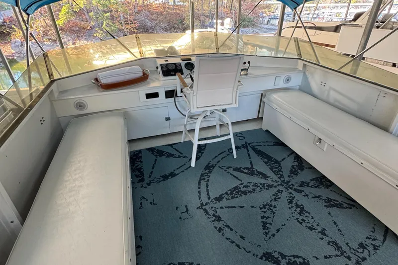 Slide: The Image of Interior of 1997 Lazy Days River Cruiser with seating and nautical-themed carpet. - 22