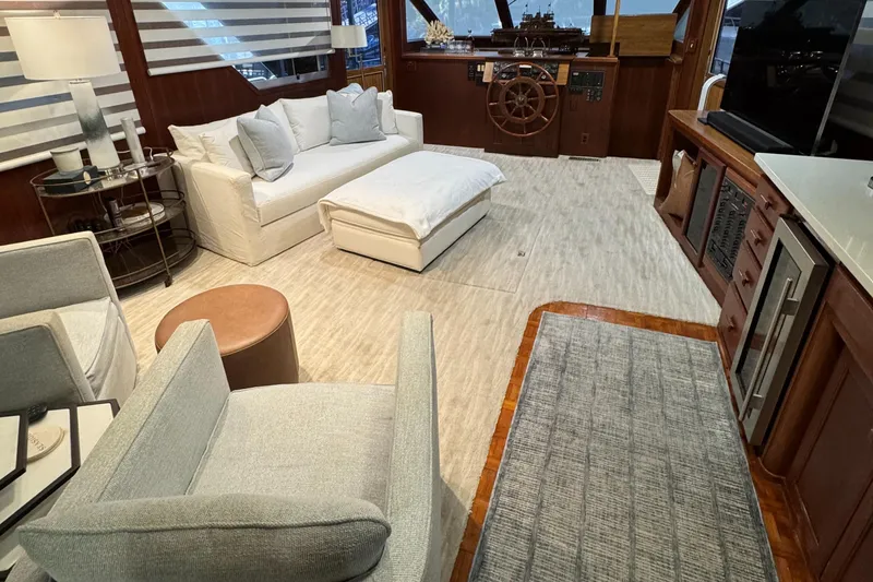 Slide: The Image of Luxurious interior of a 1997 Lazy Days River Cruiser with modern furnishings and helm. - 8