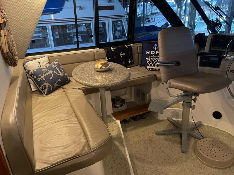 Slide: The Image of Cozy interior of 1995 Bayliner 4788 Pilot House Motoryacht with seating and nautical decor. - 12
