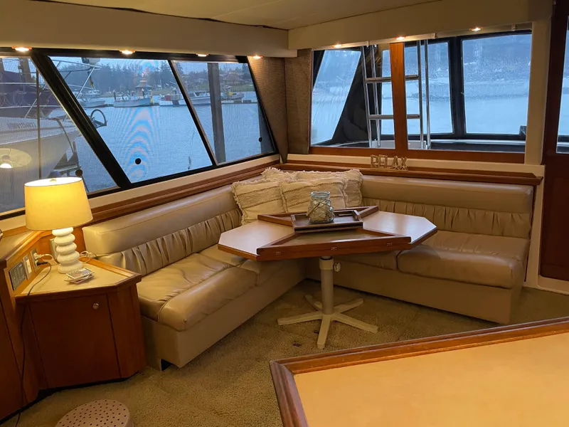 Slide: The Image of Luxurious interior of a 1995 Bayliner 4788 Pilot House Motoryacht with cozy seating and elegant decor. - 22
