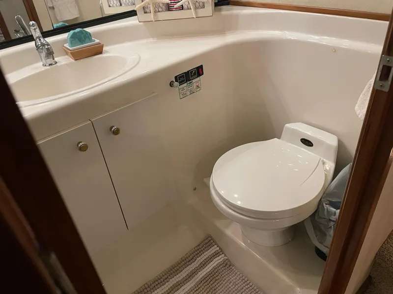 Slide: The Image of Bathroom interior of 1995 Bayliner 4788 Pilot House Motoryacht, featuring sink and toilet. - 33