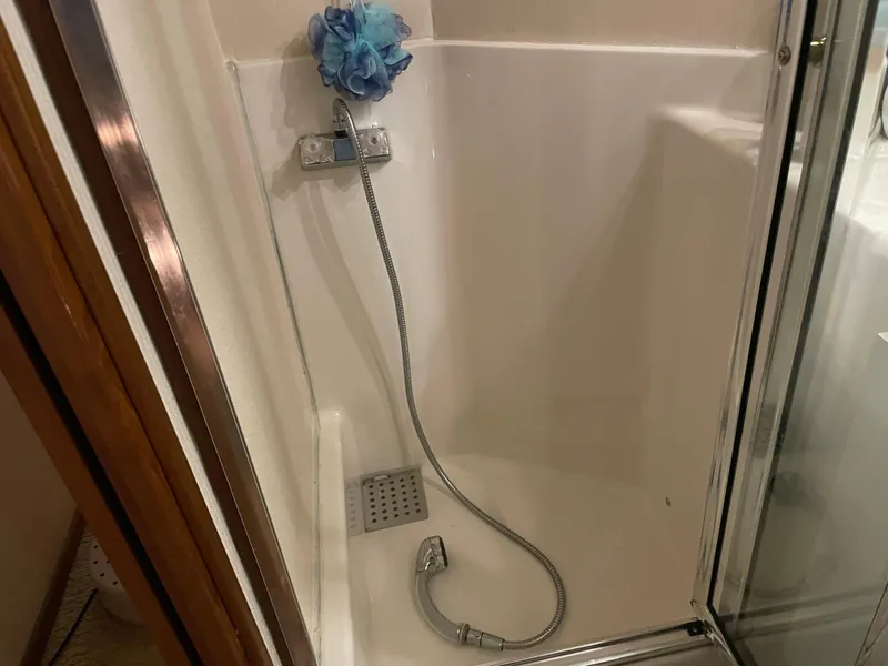 Slide: The Image of Shower area in 1995 Bayliner 4788 Pilot House Motoryacht with handheld showerhead. - 34