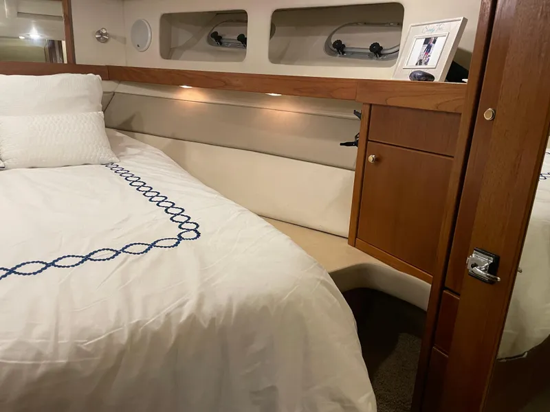 Slide: The Image of Luxurious bedroom interior of 1995 Bayliner 4788 Pilot House Motoryacht with elegant bedding. - 41