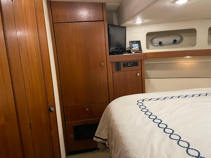 Slide: The Image of 1995 Bayliner 4788 Pilot House Motoryacht interior with wood cabinetry and cozy bedroom. - 42