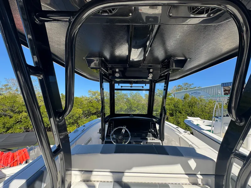 Slide: The Image of 2023 Robalo R270 Center Console boat interior with steering wheel and seating. - 35