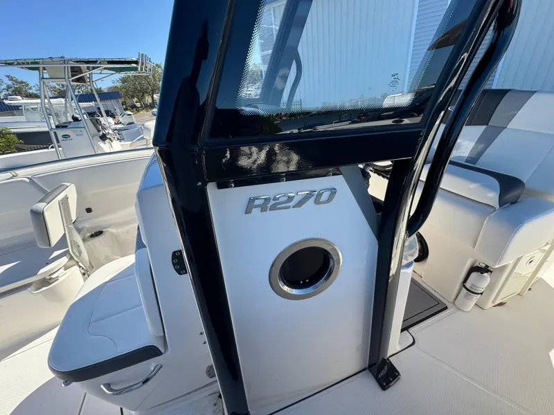 Slide: The Image of 2023 Robalo R270 Center Console boat interior, featuring sleek seating and modern design. - 37