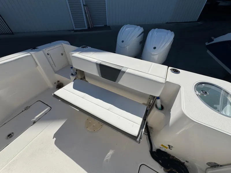 Slide: The Image of 2023 Robalo R270 Center Console boat with foldable seating and dual engines. - 40