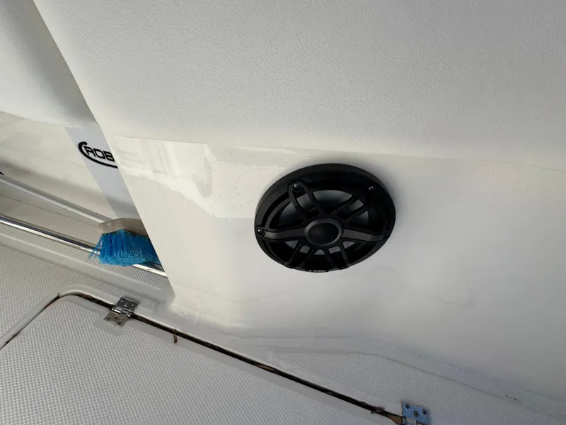 Slide: The Image of 2023 Robalo R270 Center Console boat interior with speaker and cleaning brush. - 41