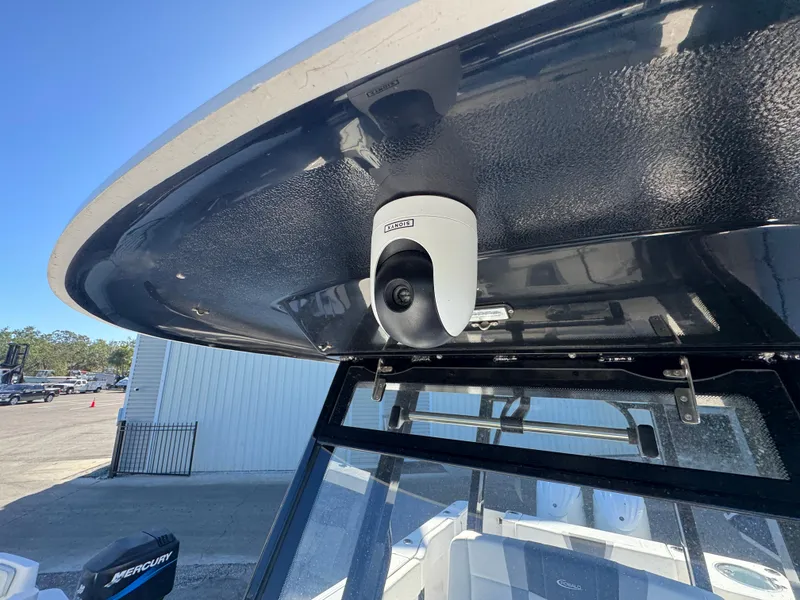 Slide: The Image of 2023 Robalo R270 Center Console boat with mounted camera on T-top. - 47