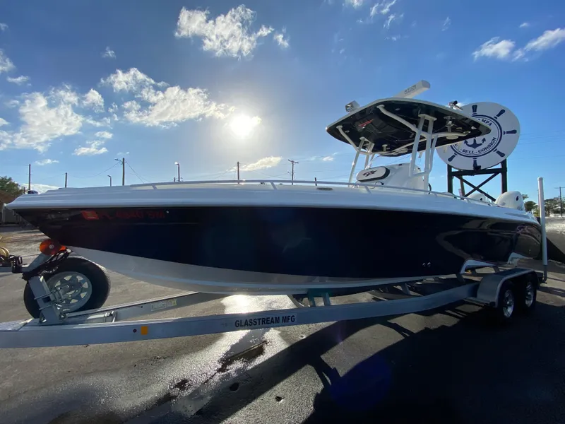 Slide: The Image of 2020 Glasstream 280 Pro-XS boat on trailer under sunny sky. - 10