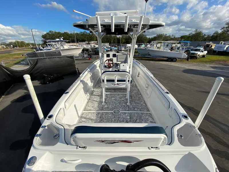 Slide: The Image of 2020 Glasstream 280 Pro-XS boat, white interior, parked outdoors under a cloudy sky. - 11