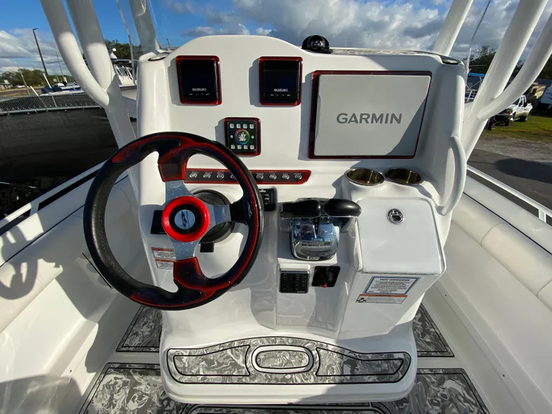 Slide: The Image of 2020 Glasstream 280 Pro-XS boat dashboard with Garmin navigation system and steering wheel. - 14