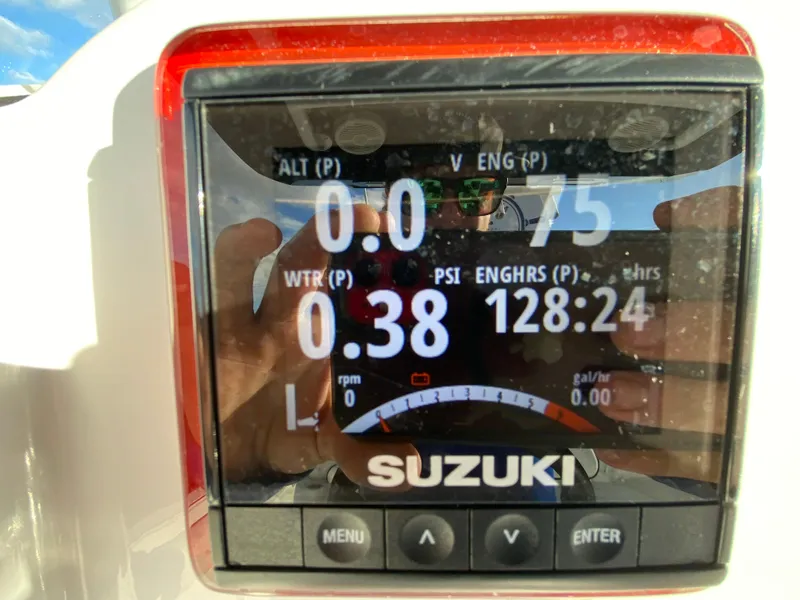 Slide: The Image of Suzuki engine display on 2020 Glasstream 280 Pro-XS boat showing various metrics. - 16