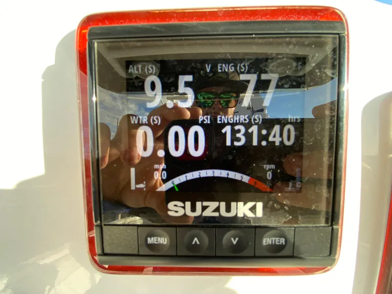 Slide: The Image of Suzuki engine display on 2020 Glasstream 280 Pro-XS boat, showing various metrics. - 17