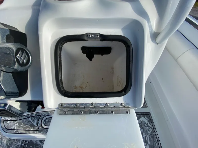 Slide: The Image of Open storage compartment on a 2020 Glasstream 280 Pro-XS boat. - 18