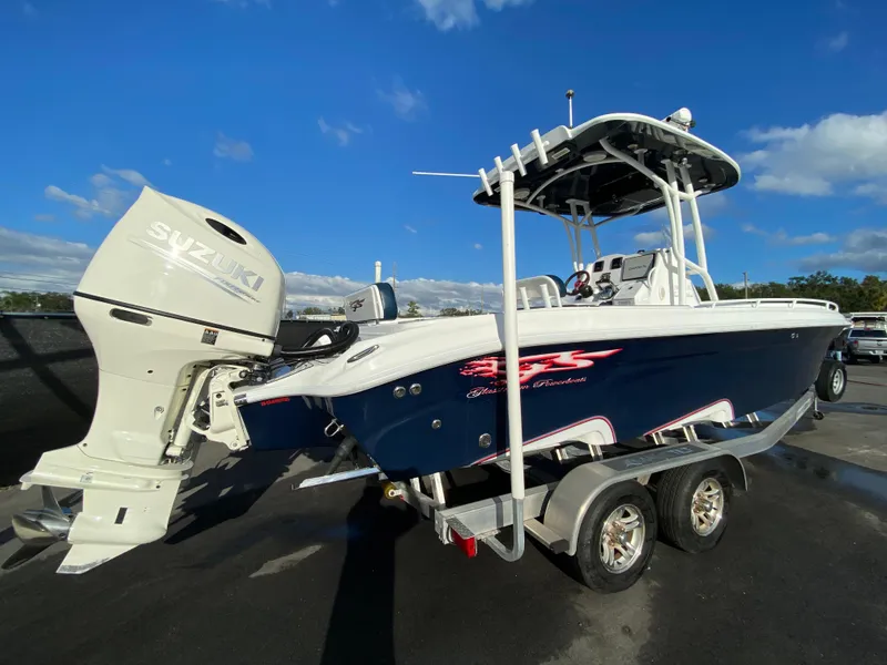 Slide: The Image of 2020 Glasstream 280 Pro-XS boat with Suzuki outboard motor on trailer. - 2