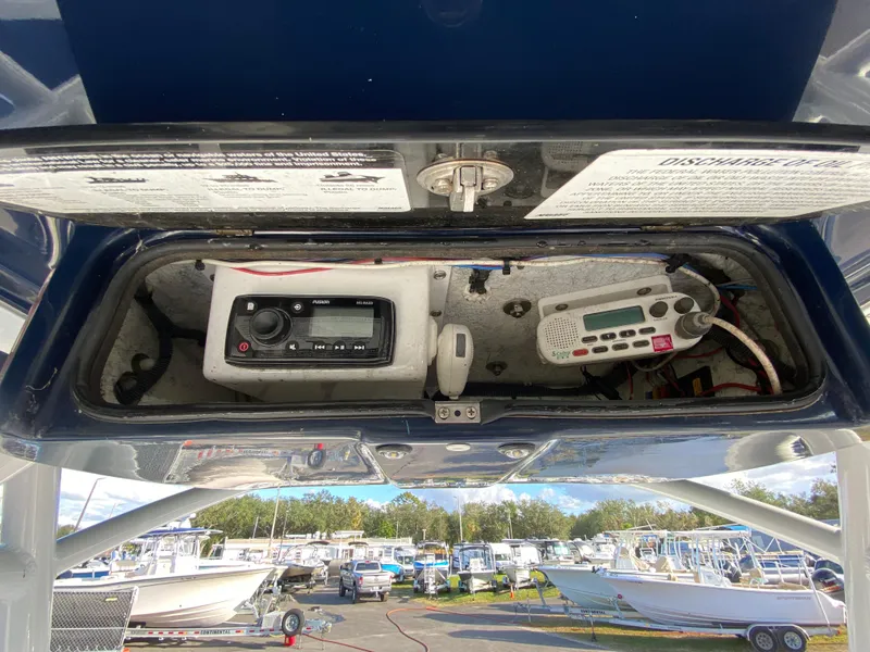Slide: The Image of 2020 Glasstream 280 Pro-XS boat electronics compartment with radio and control panel. - 20