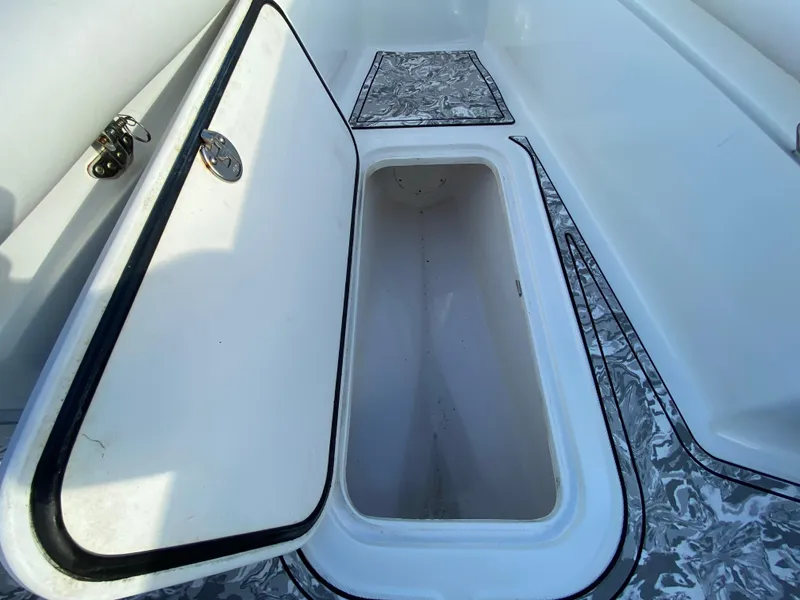 Slide: The Image of Open storage compartment on 2020 Glasstream 280 Pro-XS boat. - 28