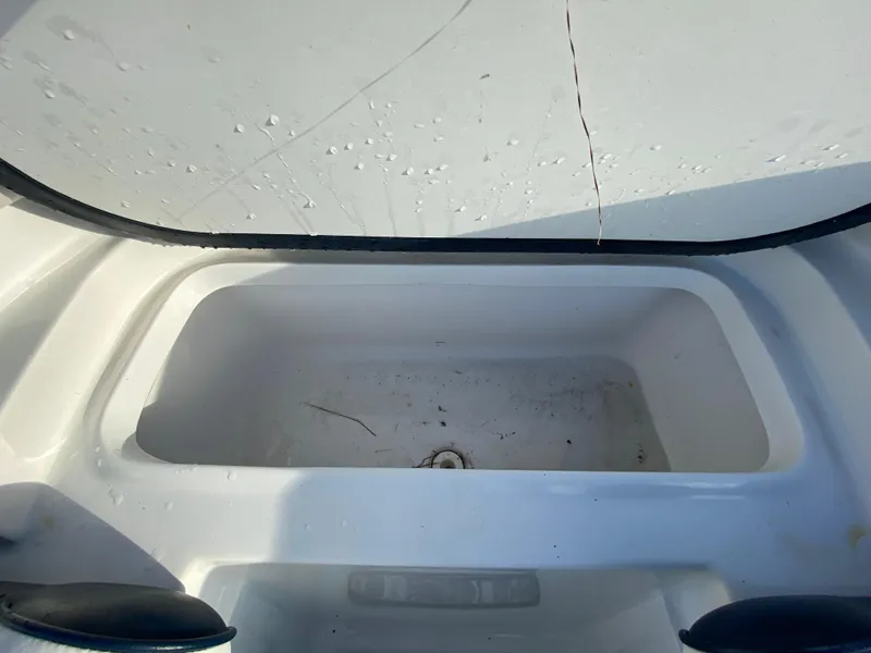Slide: The Image of 2020 Glasstream 280 Pro-XS boat storage compartment, white interior, open lid. - 33