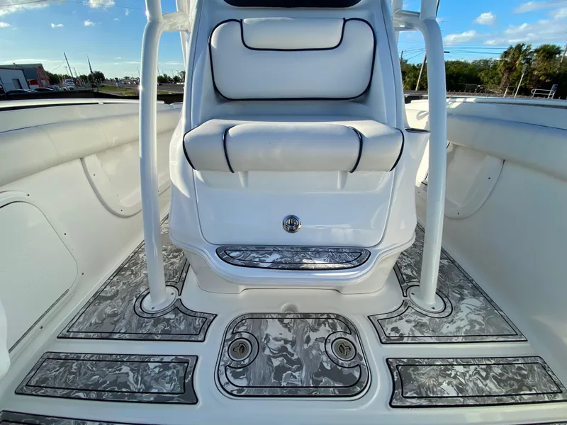 Slide: The Image of 2020 Glasstream 280 Pro-XS boat interior with cushioned seating and patterned flooring. - 37