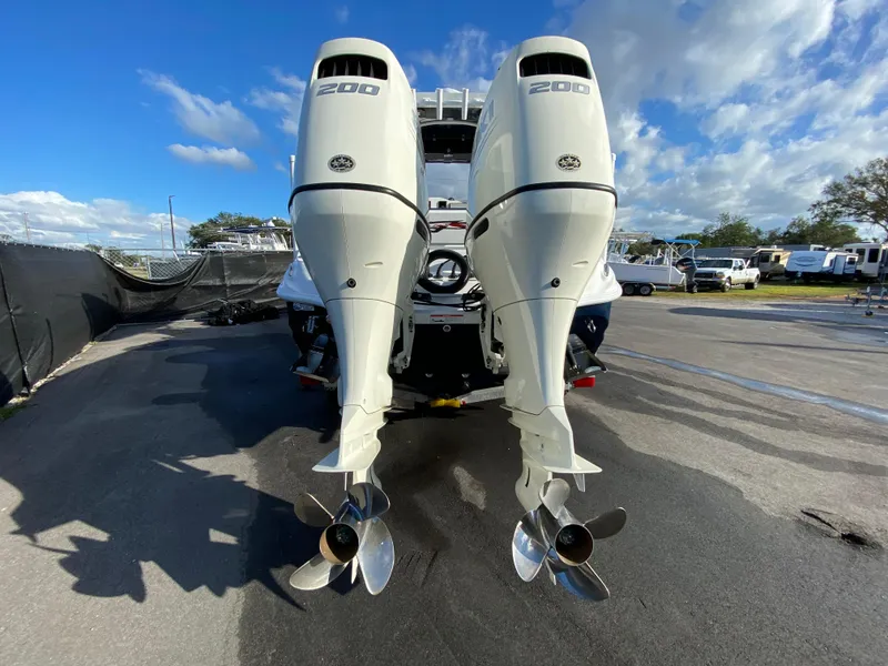 Slide: The Image of 2020 Glasstream 280 Pro-XS with twin 200 horsepower outboard engines, parked outdoors. - 4