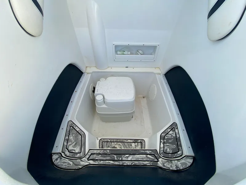 Slide: The Image of 2020 Glasstream 280 Pro-XS boat interior with compact toilet. - 40