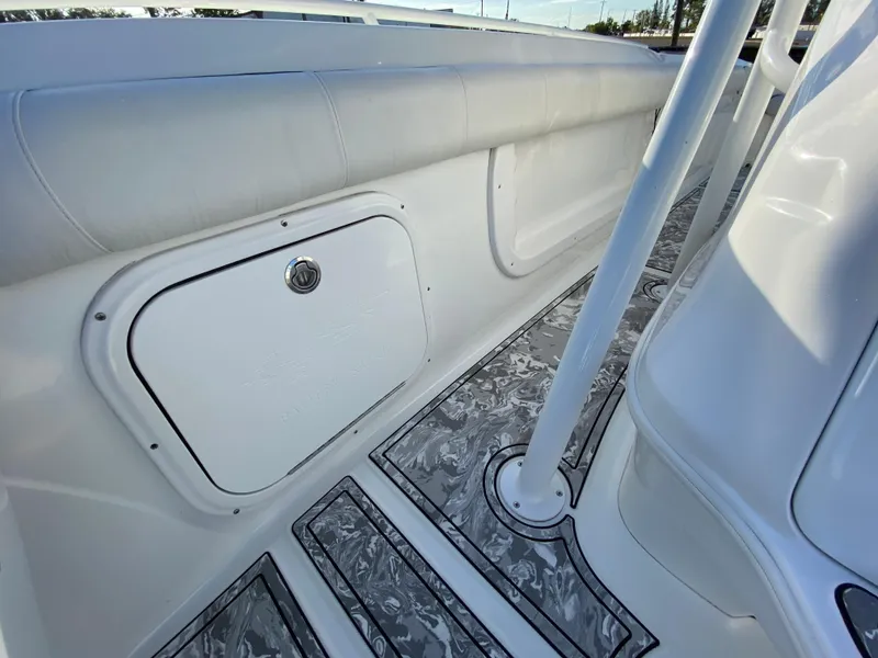 Slide: The Image of 2020 Glasstream 280 Pro-XS boat interior with storage compartment and patterned flooring. - 41
