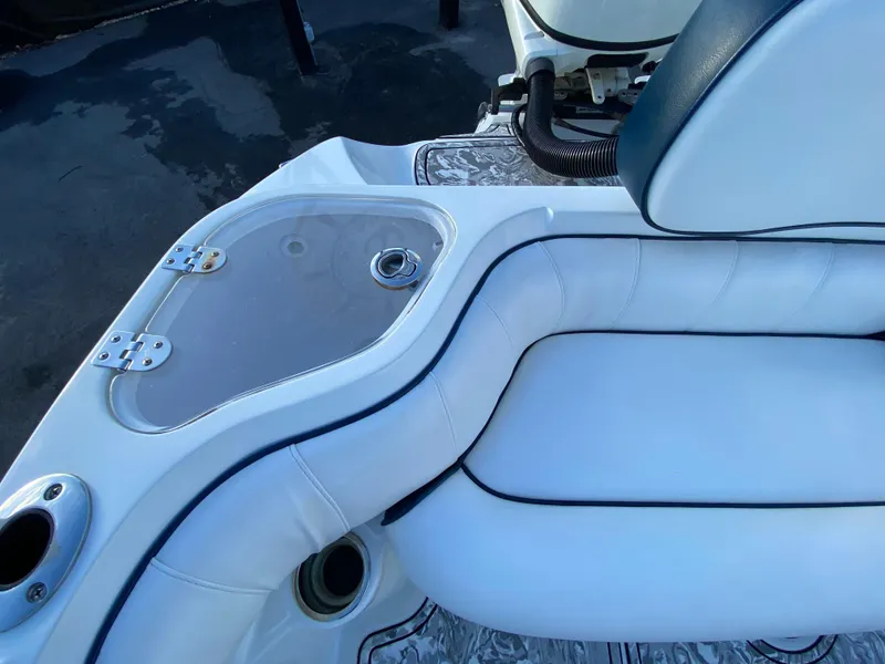 Slide: The Image of 2020 Glasstream 280 Pro-XS boat interior with white seating and storage compartment. - 47