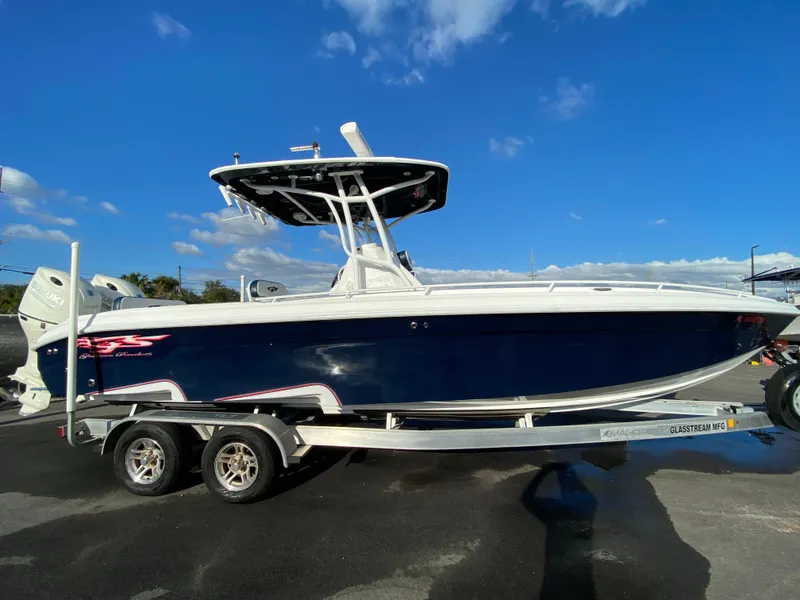 Slide: The Image of 2020 Glasstream 280 Pro-XS boat on trailer under clear blue sky. - 5