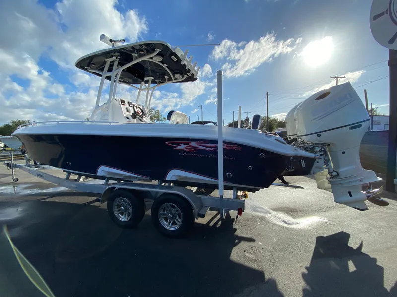 Slide: The Image of 2020 Glasstream 280 Pro-XS boat on trailer under sunny sky. - 8