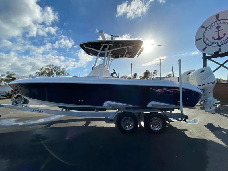 Slide: The Image of 2020 Glasstream 280 Pro-XS boat on trailer under sunny sky. - 9